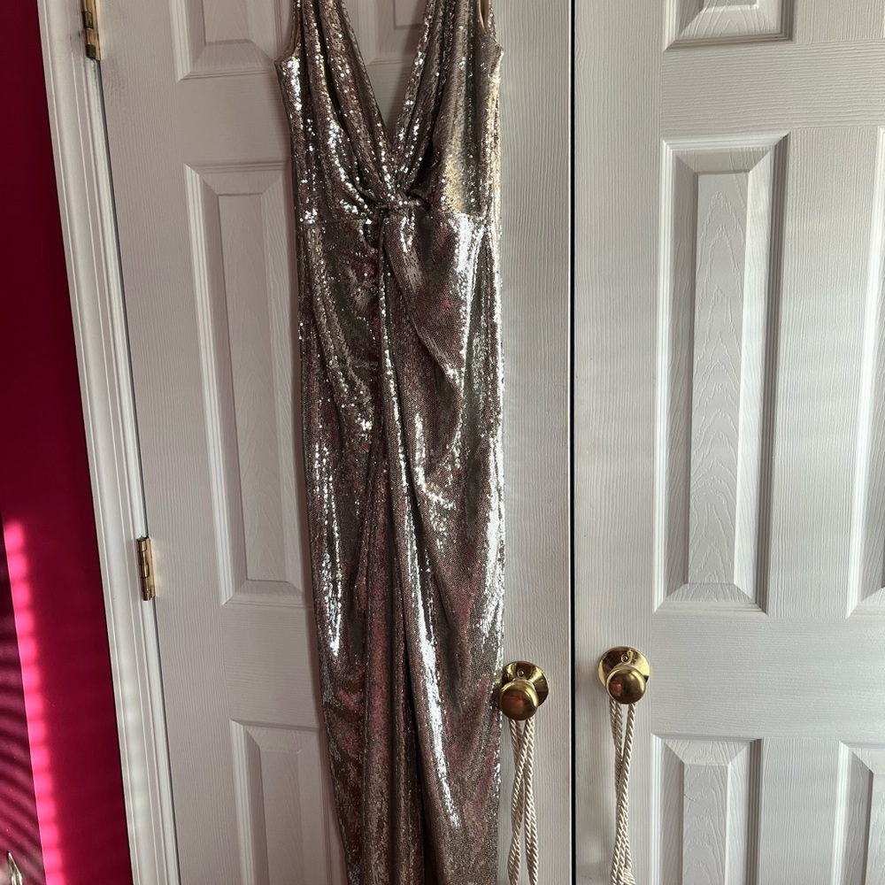 Brand new with tags still on Halston sequin straight leg halter jumpsuit.